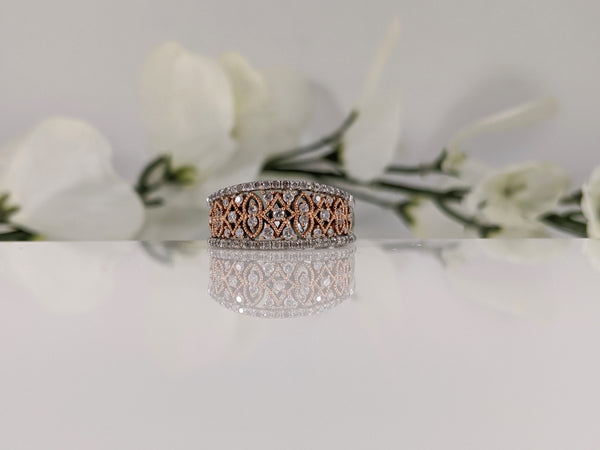 Featuring a half carat of round brilliant cut diamonds this stunning white and rose gold ring is a fabulous deal! Finger Size 7. $795.00
