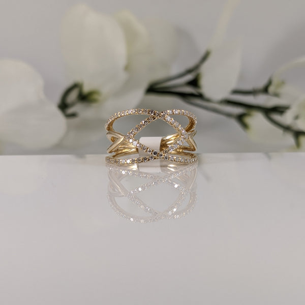 Constructed of 10k yellow gold, this open weave ring sits low to the finger. .35cttw in diamonds the ring measures 10.50mm at the top and is a finger size 5. $425.00