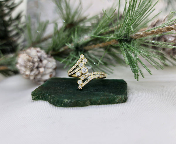 Beautifully designed ring made from 10k yellow gold and set with (6) Sixty beautiful lab grown diamonds. Measuring right at 17mm in length, this ring is the perfect length for ring finger, index finger or middle! Great piece!