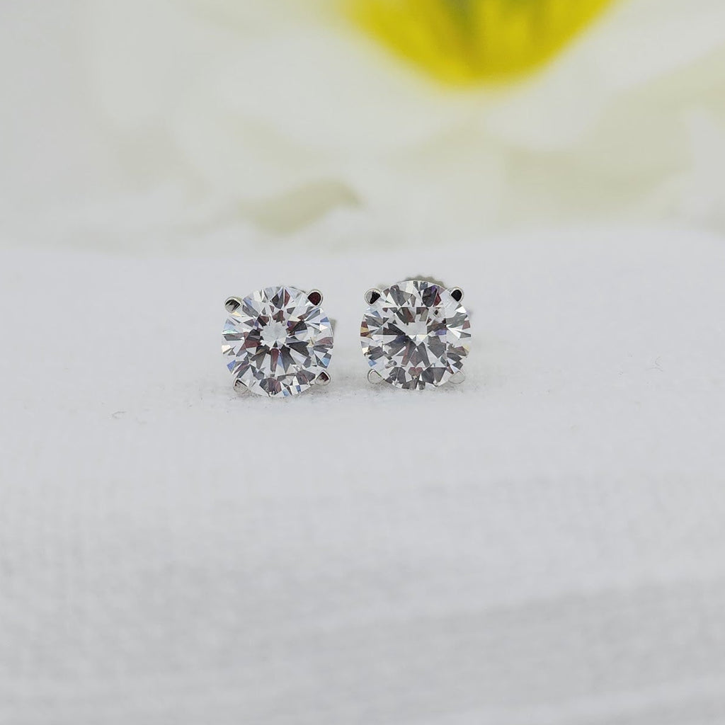 10k white gold with regular posts and backs.  2.00cttw carat total weight in created (lab grown) round brilliant cut diamonds. E color& VS1 clarity

Created (lab) diamonds are grown using modern technology and share the same physical, optical, and chemical properties as traditionally mined diamonds