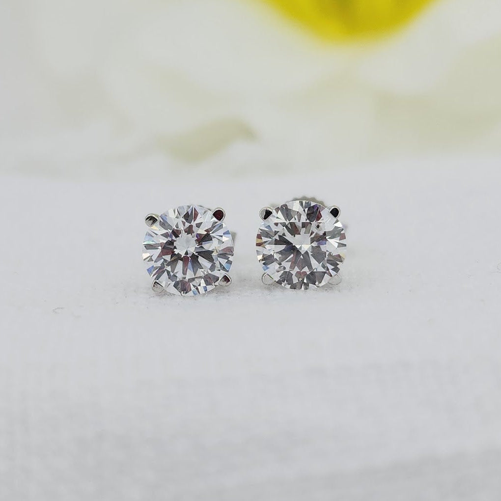 10k white gold mountings with regular posts and backs. 1.50cttw carat total weight in created (lab grown) round brilliant cut diamonds. E color VS1 clarity

Created (lab) diamonds are grown using modern technology and share the same physical, optical, and chemical properties as traditionally mined diamonds