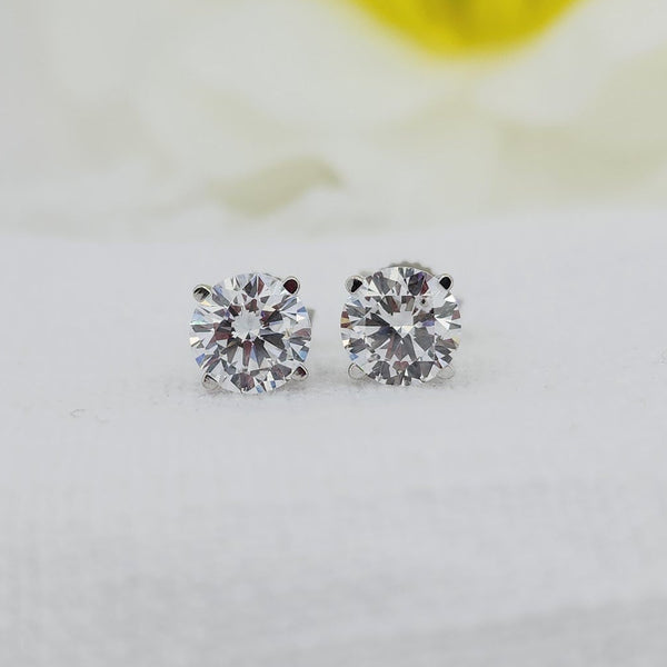 10k white gold mountings with regular posts and backs. 1.50cttw carat total weight in created (lab grown) round brilliant cut diamonds. E color VS1 clarity

Created (lab) diamonds are grown using modern technology and share the same physical, optical, and chemical properties as traditionally mined diamonds