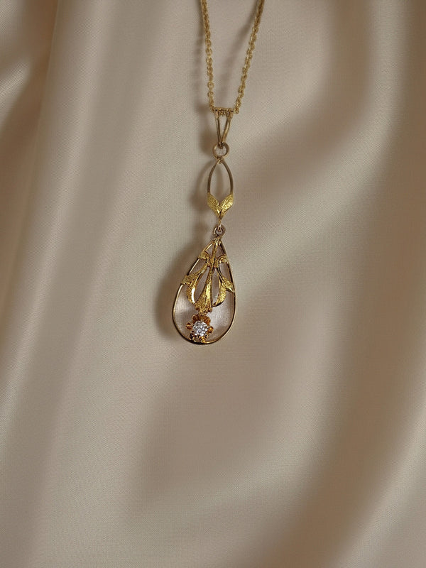 Beautiful Lavalier made in 10K yellow gold and set with a small .035ct natural mined old mine cut diamond. From the bail top to the bottom of the lavalier measures 33.00mm in length and 9.00mm at it's widest point. Hung on an 18" inch 14ky gold cable chain