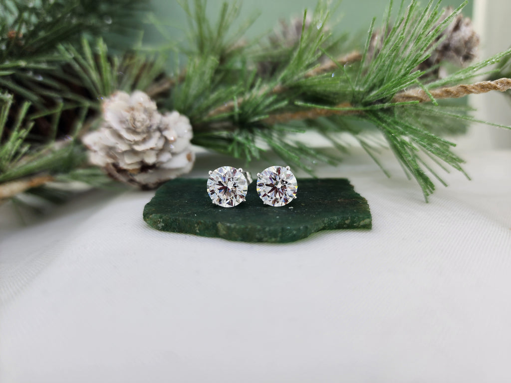 Classic four prong 14k white gold mountings hold these two beautiful diamonds! Combined carat weight of 2.42cts, natural mined diamonds. G color, I1 clarity. Beautiful cut!