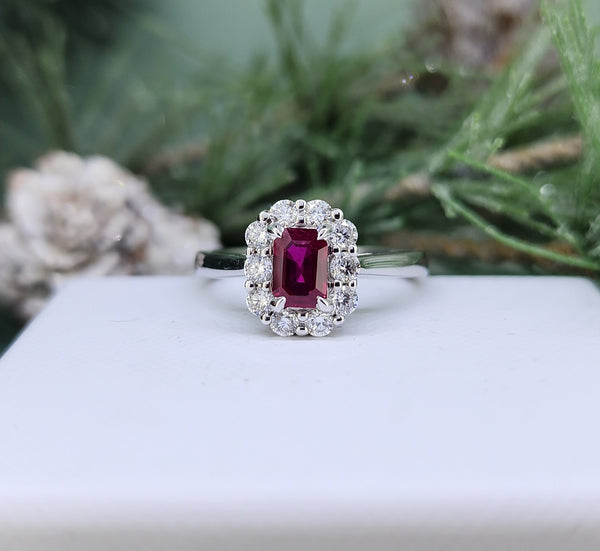 Timeless and refined, this 14k white gold ring features a vivid emerald-cut natural ruby weighing 0.50 carats. This lovely ruby is beautifully framed by a halo of sparkling natural mined diamonds, adding brilliance and balance to the design. With approximately 0.50 carats total weight in diamonds.

Metal:14k Gold
Metal Color: White Gold
Diamond TCW:  0.50 TCW (total carat weight)
Ruby TCW: 0.50 TCW (total carat weight)
Ring Size: 6
Ring Width at the halo: 8.00mm
