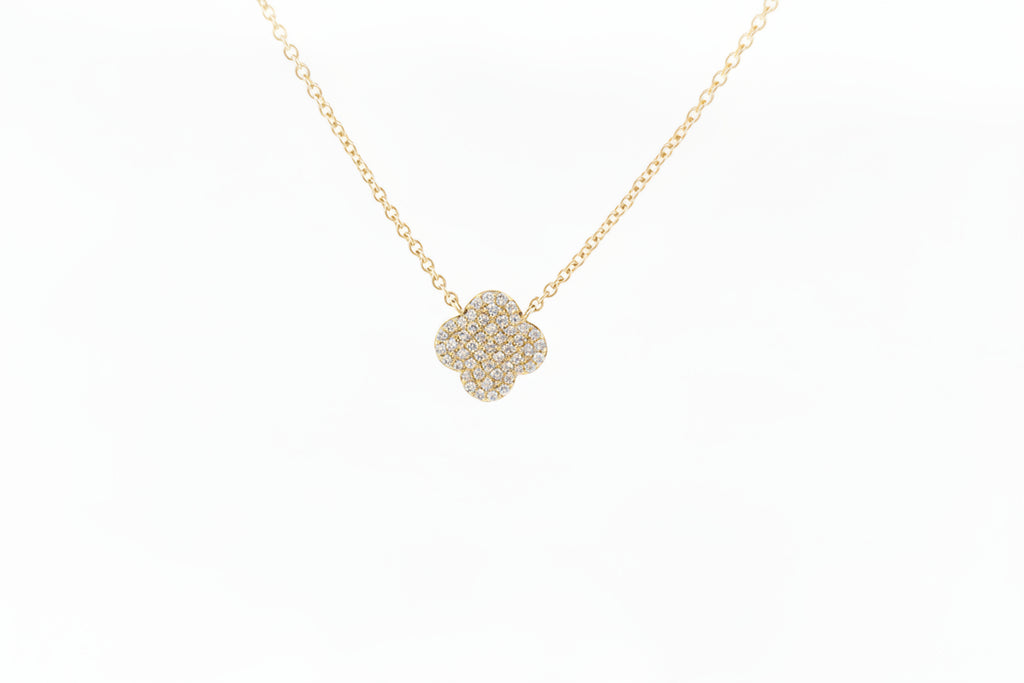 Constructed of 14k yellow gold, this fabulous clover pendant is pave set with .16cttw in round brilliant cut natural diamonds! A very lively piece, this pendant shimmers and sparkles! Attached to a 16 inch 14k yellow gold nice cable chain with a lobster claw