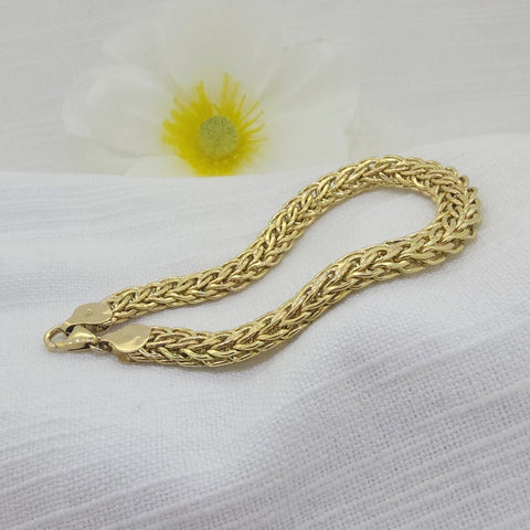 Crafted in 14K yellow gold, this elegant estate bracelet features a beautifully woven hollow link design that offers both visual texture and lightweight comfort. Measuring 8.00mm wide, the intricate weave creates a classic yet substantial look, making it a versatile piece for everyday wear or layering with other favorites.
At 7 inches in length, the bracelet is finished with a secure lobster clasp and weighs 6.60 grams. Its timeless woven design gives it a sophisticated presence while maintaining an easy, 