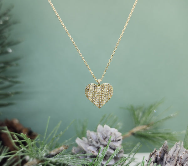 This gorgeous pendant is made from 14k yellow gold and is set with (89) eight nine single cut natural mined diamonds with a combined diamond carat weight of .22cts. This beautiful pave set pendant just sparkles! Petite, measuring 11.58mm in length and 11.23mm in width. The chain is an 18" inch adjustable chain with a medium size spring clasp. Total gram weight of the pendant and chain (including the diamonds) is 2.30grams