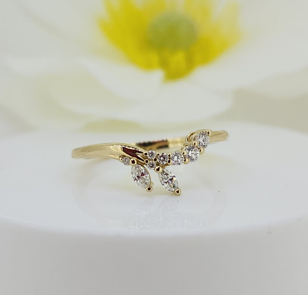 14k Yellow Gold Diamond Wrap Ring – on a white background
Delicate and beautifully styled, this 14k yellow gold diamond wrap ring features an elegant open design accented with .20 carat total weight in natural mined diamonds. Round brilliant and marquise-shaped diamonds create a graceful, leaf-inspired silhouette that softly wraps the finger for a modern yet feminine look.
14k yellow gold
.20ctw in natural mined diamonds