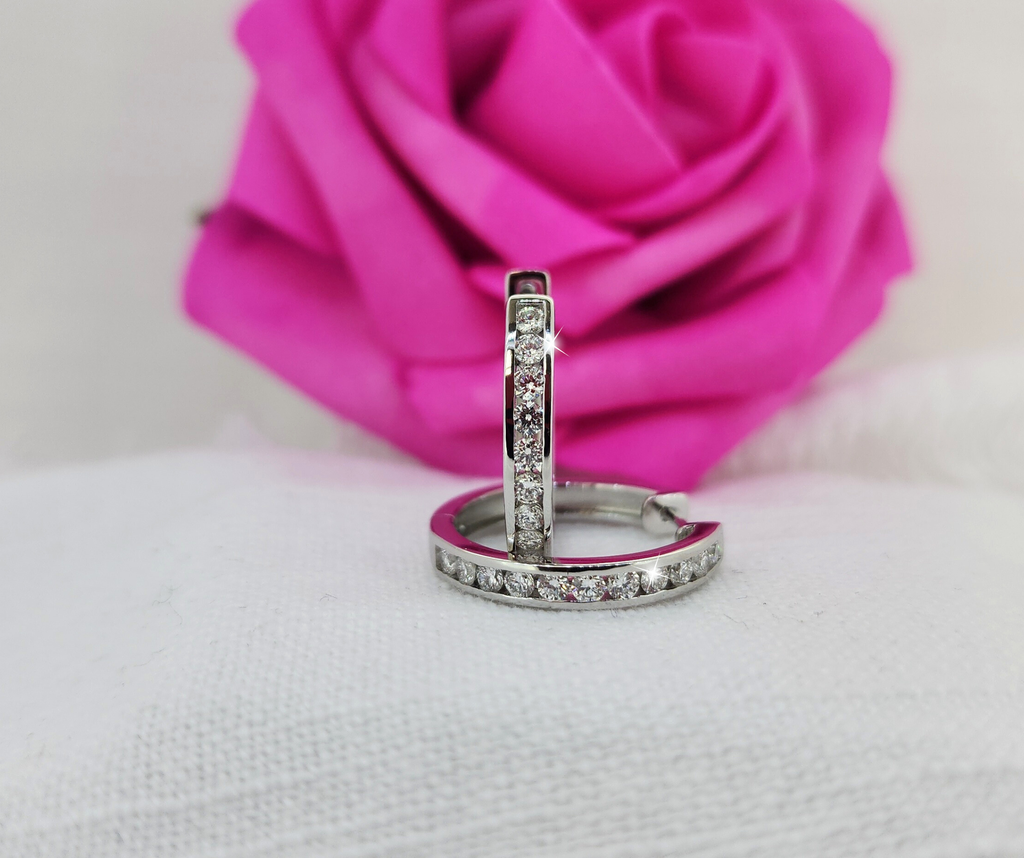 These are so fabulous! 925 Sterling silver hoops set with 1.00cttw in round brilliant cut lab grown diamonds. Perfect size hoops! Slightly bigger than a penny! Limited quantity! On sale through Valentin's Day! (Feb. 14th)