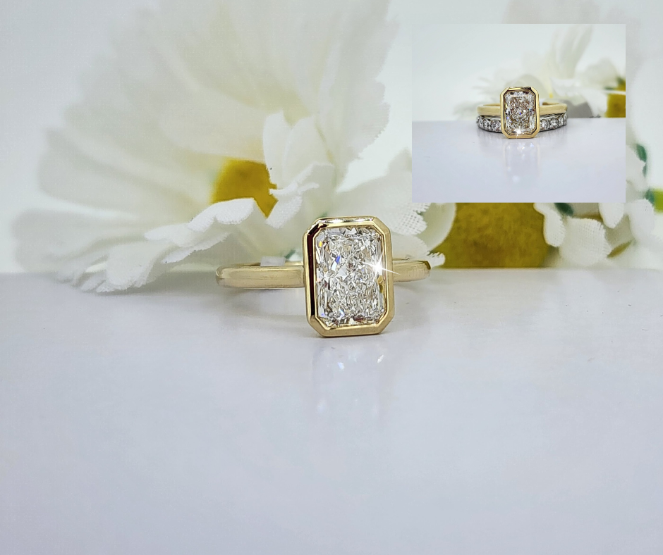 This is a great engagement ring! The design is so versatile it fits up next to almost any band! Made from 14K yellow gold and set with a 2.00ct Radiant Lab Grown diamond. E color VS1 clarity, Comes with an IGI lab report. So stunning! *White gold diamond band pictured in set not included