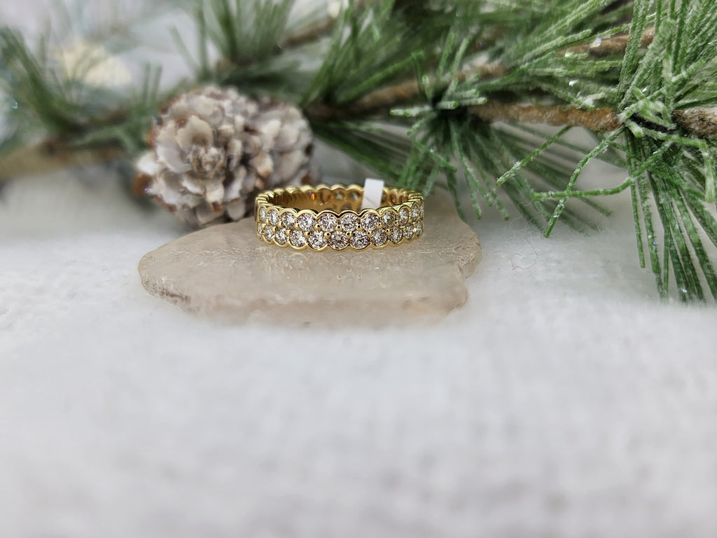 14k yellow gold holds (38) thirty eight round brilliant cut lab grown diamonds. With no prongs, this contemporary designed band is great for daily wear! The ring measures 4.63mm and at the shank