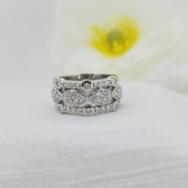 This bold 925 sterling silver statement ring is set with an impressive 1.35 carat total weight of Created (lab) diamonds, all round brilliant cut for exceptional sparkle and fire. The wide band design showcases intricate diamond detailing, creating a luxurious look with substantial presence on the hand.

Measuring 11.57mm at the top and tapering slightly to a 10.19mm shank, this ring is designed to stand beautifully on its own while offering a comfortable, confident fit. A striking choice for those who love