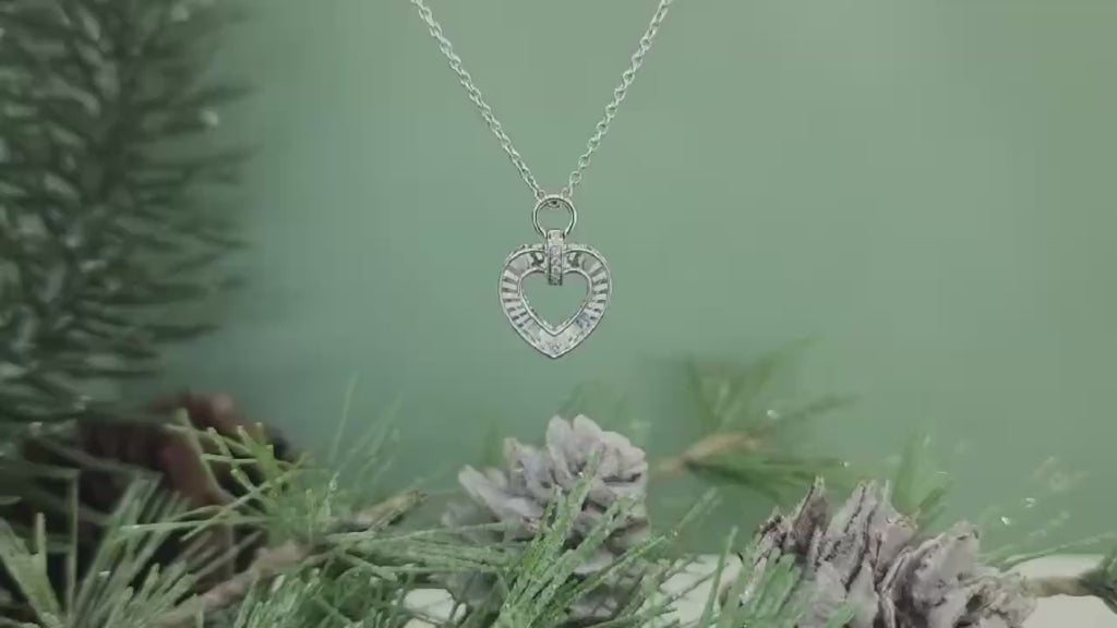 This fabulous&nbsp;14k white gold fluted heart pendant is just stunning! The motion video says it all! Hung on a 14k white gold 18" inch cable chain. The heart measures 15.55mm in length and 11.00mm in width