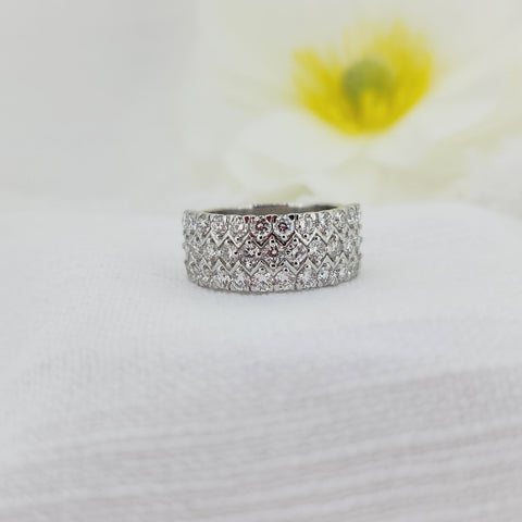 This timeless 925 sterling silver band is set with an impressive 1.80 carat total weight of Created (lab) diamonds, offering brilliant sparkle in a refined, classic design. The diamonds are carefully set to create a continuous, eye-catching shimmer across the band, making this ring a standout piece that wears beautifully on its own.

Measuring 8.30mm at the top and tapering to a 6.78mm shank, this ring provides a substantial yet comfortable profile on the hand. A versatile and elegant choice,