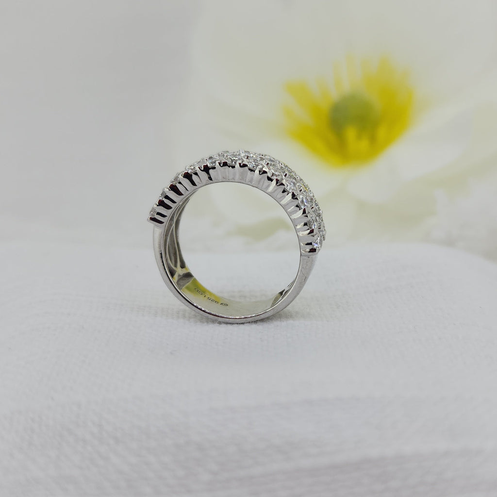 This timeless 925 sterling silver band is set with an impressive 1.80 carat total weight of Created (lab) diamonds, offering brilliant sparkle in a refined, classic design. The diamonds are carefully set to create a continuous, eye-catching shimmer across the band, making this ring a standout piece that wears beautifully on its own.

Measuring 8.30mm at the top and tapering to a 6.78mm shank, this ring provides a substantial yet comfortable profile on the hand. A versatile and elegant choice