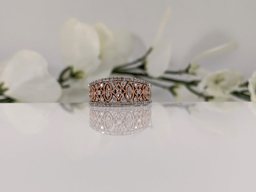 Featuring a half carat of round brilliant cut diamonds this stunning white and rose gold ring is a fabulous deal! Finger Size 7. $795.00