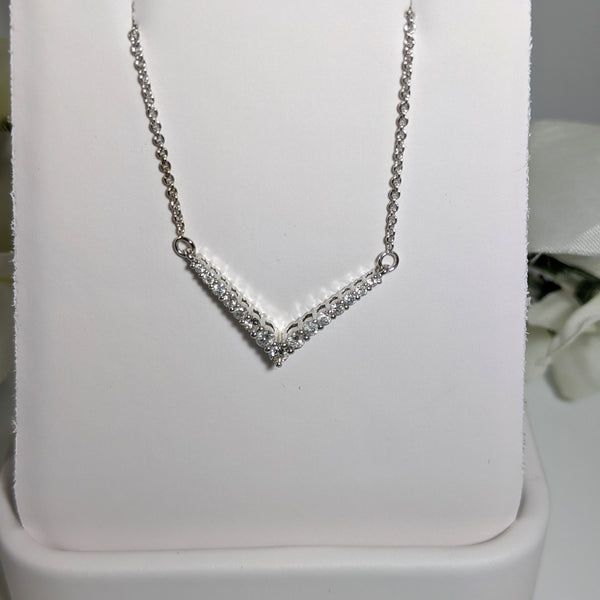 Constructed of 10K white gold and set with .38cttw in round brilliant cut diamonds this is a stunning piece that will wear well with jeans or that little black dress! Total length of necklace to tip of the V is 18" inches. $425.00