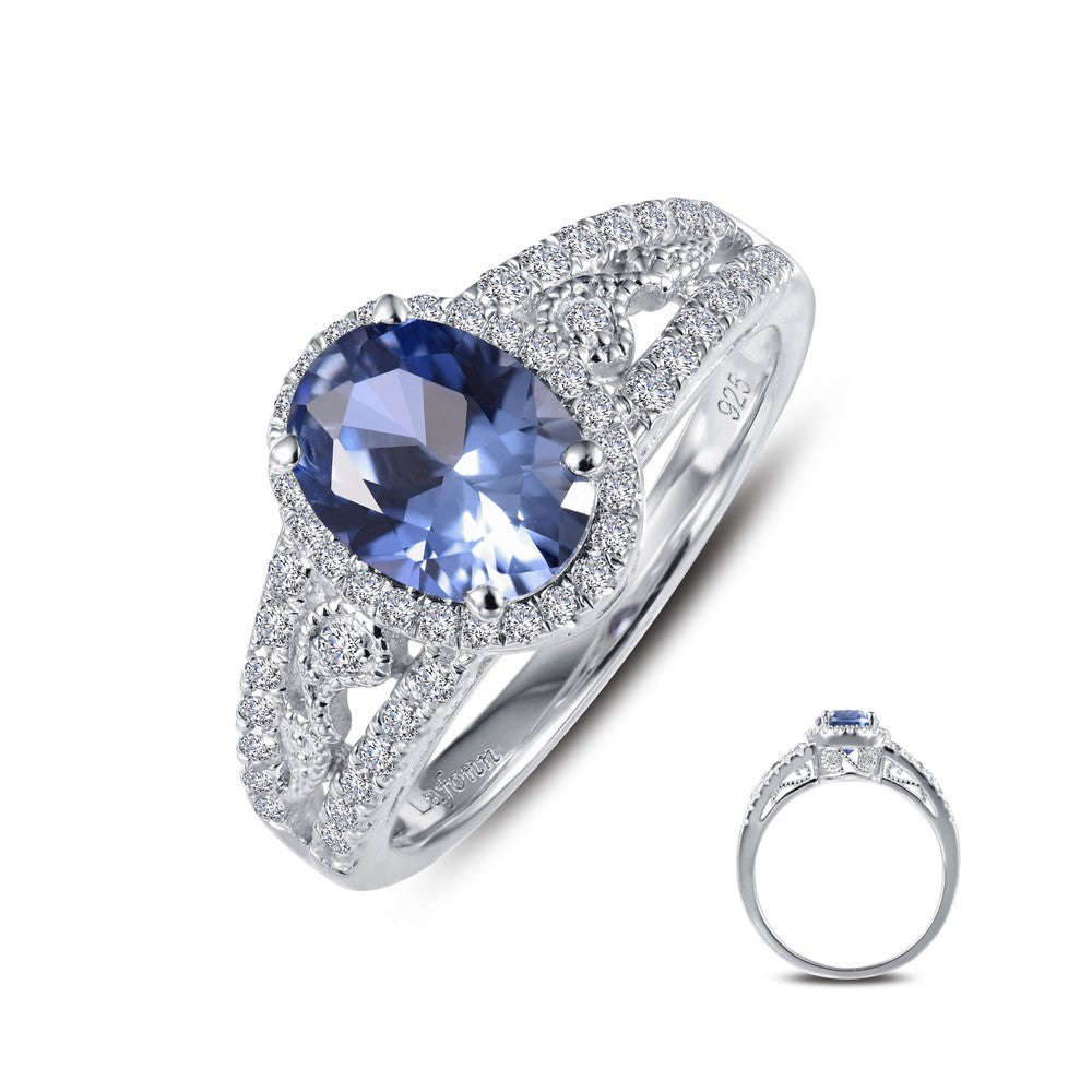A glamorous and eye-catching statement piece. This vintage-inspired ring features an oval Lafonn Lassaire simulated tanzanite with Lassaire simulated diamonds. This ring is set in sterling silver bonded with platinum. Finger size 7. $195.00