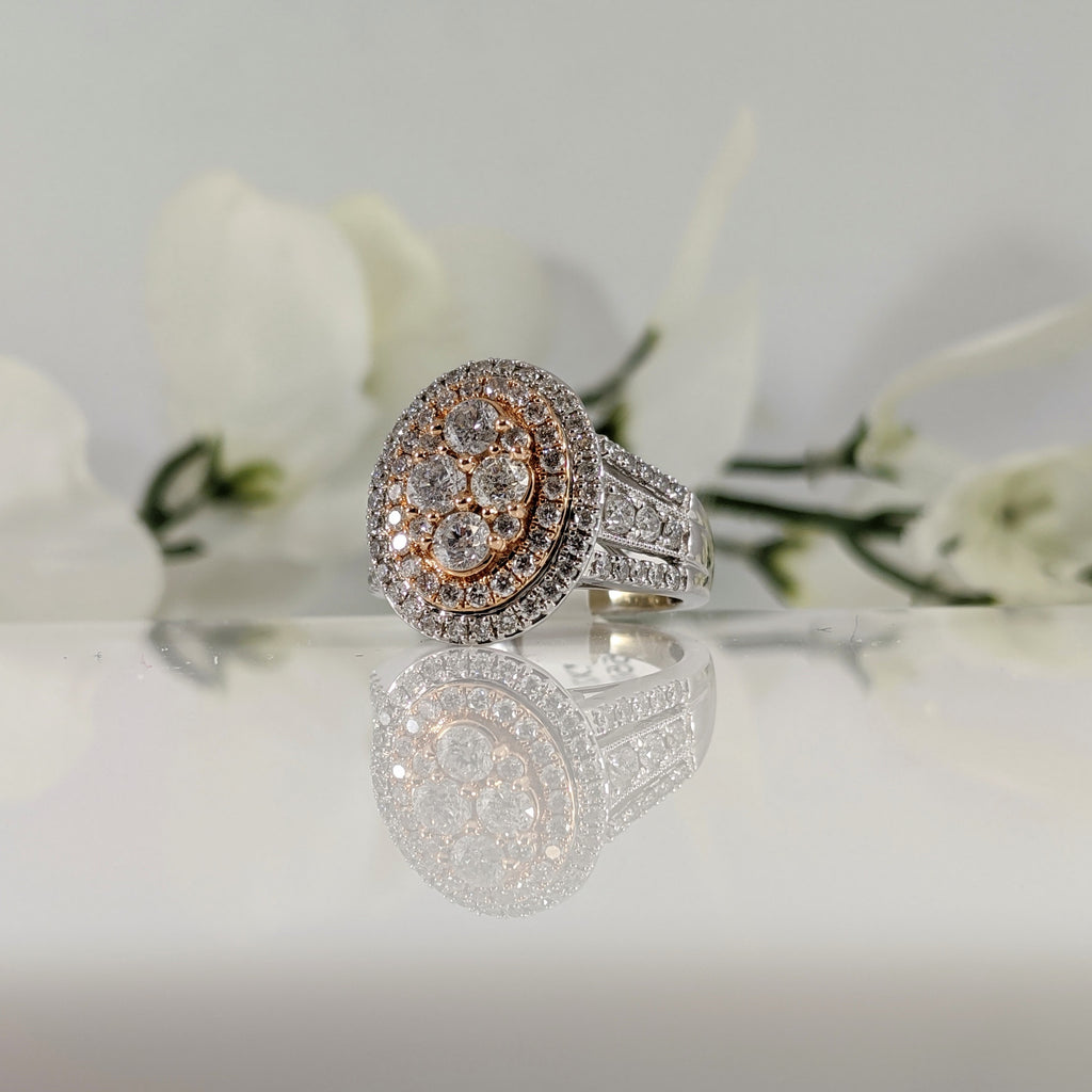 10k white and rose gold diamond ring. 2.00cttw in round brilliant cut diamonds. Wide, double halo ring. $2500.00