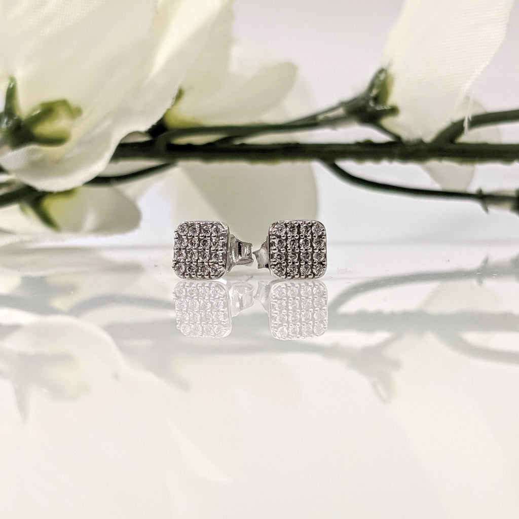14k white gold multi diamond earrings. These stunning earrings look like they are close to a full carat each when actually the combined total weight of the earrings is .25cttw. Bright and sparkly just in time for the Holidays. $690.00.