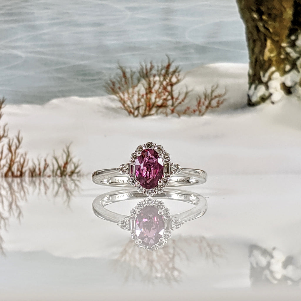 Stunning 14K white gold and natural ruby diamond ring! This ring features an AA quality 6x4mm Ruby! .20cttw in a combination of baguette and round cut diamonds give this ring a shimmer and sparkle that is stunning! Finger size 6.50. $1770.00