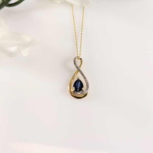 Visible color zoning may not be desirable in gemstones but in this Sapphires case, I'd argue that. I like the stripe in the center of this stone that breaks up varying shades of blue. A swirl of diamonds accent this 22.00mm in length pendant. Lovely and affordable! $350.00  *chain not included