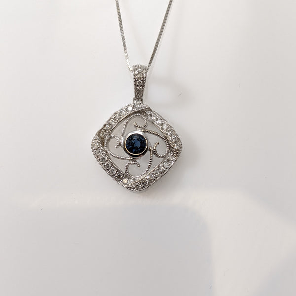 Vintage inspired, this lovely pendant is set with a 420mm round natural blue Sapphire. The Sapphire is a vibrant blue that is really showcased by the white gold and the .20cttw in round brilliant cut diamonds. Chain sold separately. $1125.00